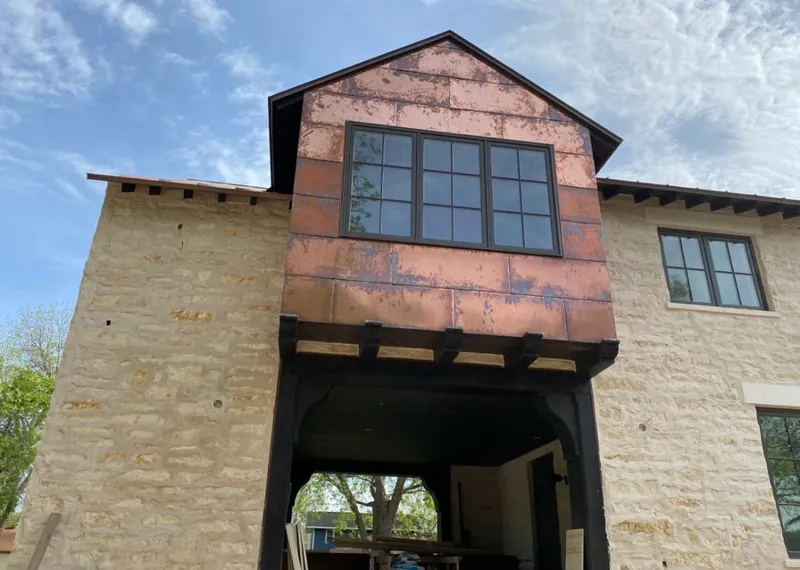 Copper metal panel facade on a stone building for Metal Roof Coating in San Jose
